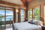 Master bedroom with Queen bed, private deck outside.